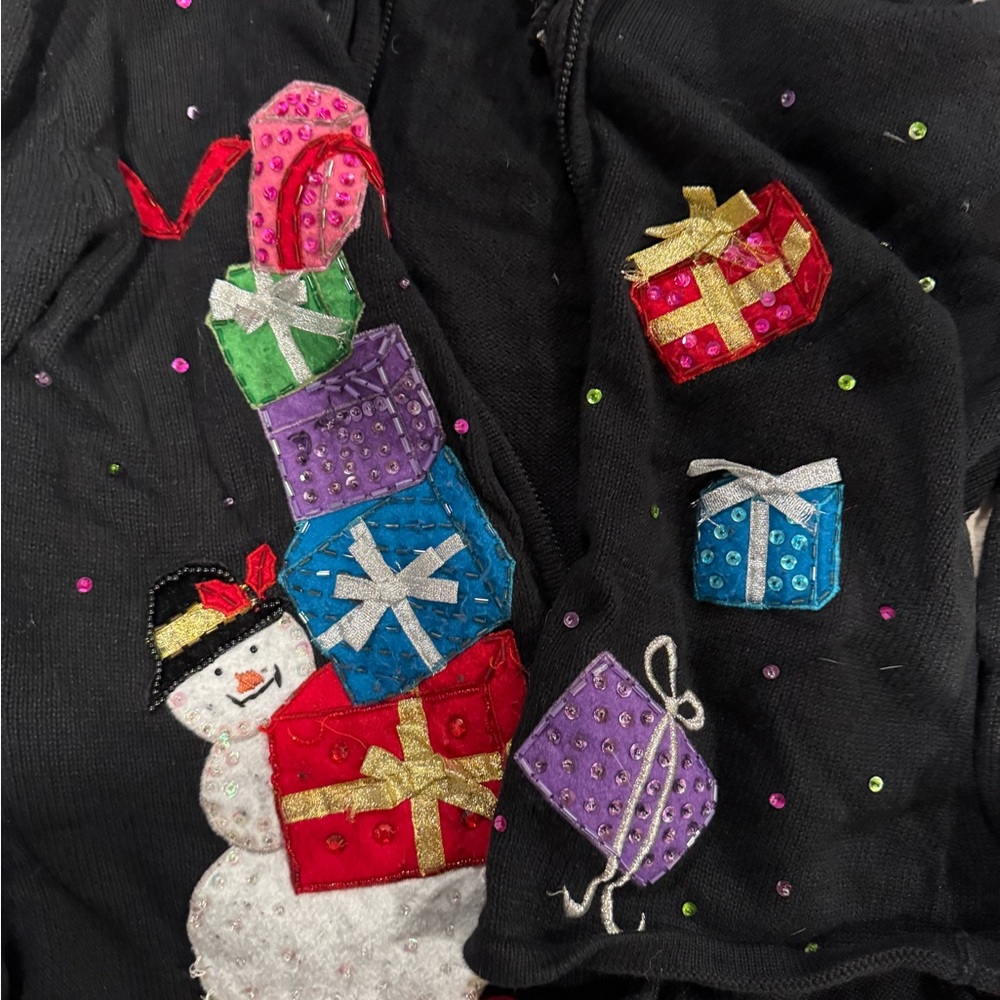 Festive Black Sweater with snowman and one sweater with poinsettias flowers red